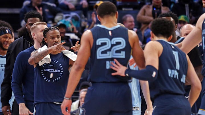Mar 5, 2025; Memphis, Tennessee, USA; Memphis Grizzlies guard Ja Morant (12) reacts toward guard Desmond Bane (22) and guard Scotty Pippen Jr. (1) during a time out in the second quarter against the Oklahoma City Thunder at FedExForum. Mandatory Credit: Petre Thomas-Imagn Images Mar 5, 2025; Memphis, Tennessee, USA; Memphis Grizzlies guard Ja Morant (12) reacts toward guard Desmond Bane (22) and guard Scotty Pippen Jr. (1) during a time out in the second quarter against the Oklahoma City Thunder at FedExForum. Mandatory Credit: Petre Thomas-Imagn Images