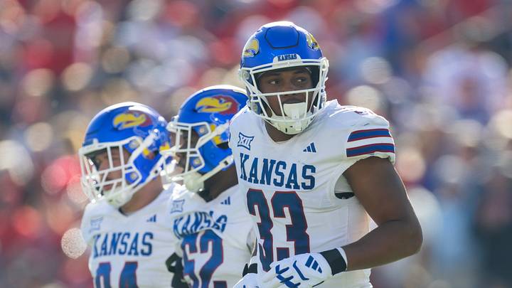 Nov 8, 2025; Tucson, Arizona, USA; Kansas Jayhawks defensive end Leroy Harris III (33) against the Arizona Wildcats at Arizona Stadium. Mandatory Credit: Mark J. Rebilas-Imagn Images Nov 8, 2025; Tucson, Arizona, USA; Kansas Jayhawks defensive end Leroy Harris III (33) against the Arizona Wildcats at Arizona Stadium. Mandatory Credit: Mark J. Rebilas-Imagn Images