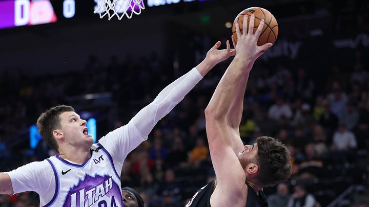 Oct 29, 2025; Salt Lake City, Utah, USA; Utah Jazz center Walker Kessler (24) and Portland Trail Blazers center Donovan Clingan (23) go for a rebound during the first quarter at Delta Center. Mandatory Credit: Rob Gray-Imagn Images