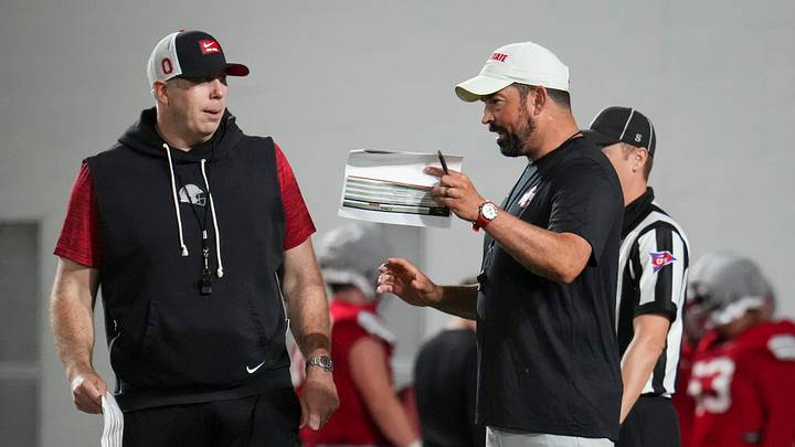 Ohio State Buckeyes head coach Ryan Day talks to Ohio State Buckeyes offensive coordinator Arthur Smith during football training camp inside the Woody Hayes Athletic Center in Columbus on Aug. 7, 2026.