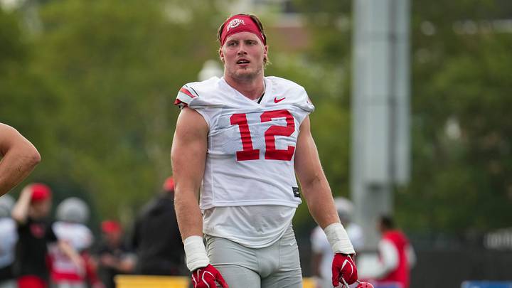 Ohio State Buckeyes defensive end Beau Atkinson (12) waits between drills during the first practice of training camp at the Woody Hayes Athletic Center in Columbus on Aug. 6, 2026. Ohio State Buckeyes defensive end Beau Atkinson (12) waits between drills during the first practice of training camp at the Woody Hayes Athletic Center in Columbus on Aug. 6, 2026.