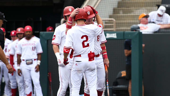 Indiana's Jasen Oliver (2) and Indiana's Tyler Cerny (8) celebrate after Oliver hits a home run during a NCAA Baseball Tournament Knoxville Regional game at Lindsey Nelson Stadium on Sunday, June 2, 2024 in Knoxville, Tenn.