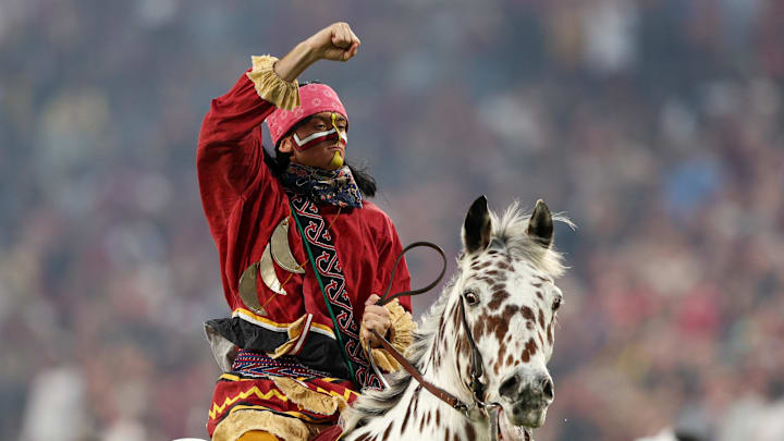 Dec 29, 2022; Orlando, Florida, USA; Florida State Seminoles Chief Osceola and horse Renegade entertain the crowd before the 2022 Cheez-It Bowl against the Oklahoma Sooners at Camping World Stadium. Mandatory Credit: Nathan Ray Seebeck-Imagn Images