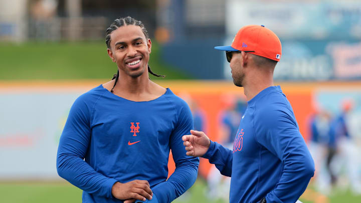 Feb 17, 2026; Port St. Lucie, FL, USA; New York Mets infielder Francisco Lindor (12) speaks to bench coach Kai Correa (50) during spring training at Clover Park. Mandatory Credit: Sam Navarro-Imagn Images