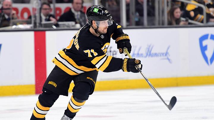 Apr 14, 2026; Boston, Massachusetts, USA; Boston Bruins left wing Viktor Arvidsson (71) passes the puck during the second period against the New Jersey Devils at TD Garden. Mandatory Credit: Bob DeChiara-Imagn Images