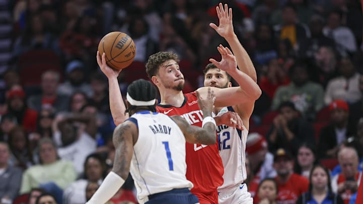 Jan 1, 2025; Houston, Texas, USA; Houston Rockets center Alperen Sengun (28) controls the ball as Dallas Mavericks forward Maxi Kleber (42) defends during the fourth quarter at Toyota Center. Mandatory Credit: Troy Taormina-Imagn Images