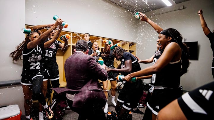 Mississippi State players and coaches celebrate after Thursday's upset win against No. 15 Tennessee.