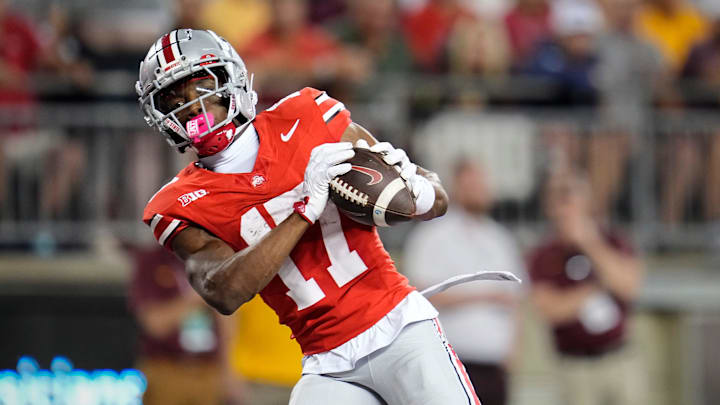 Ohio State Buckeyes wide receiver Carnell Tate (17) catches a touchdown pass during the first half of the NCAA football game against the Minnesota Golden Gophers at Ohio Stadium in Columbus on Oct. 4, 2025.