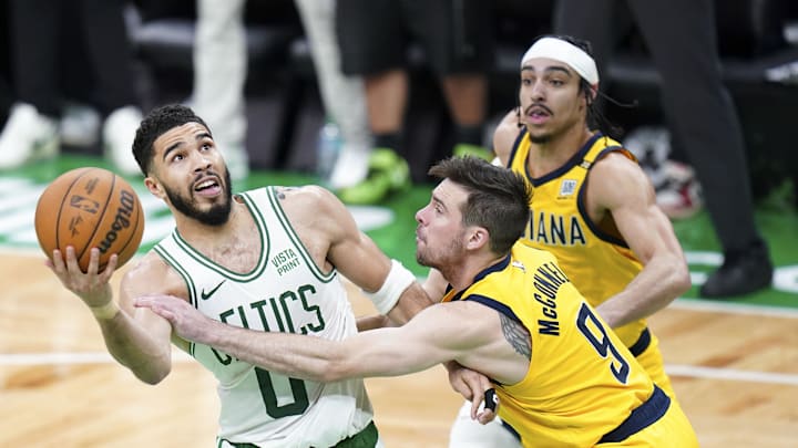 May 21, 2024; Boston, Massachusetts, USA; Indiana Pacers guard T.J. McConnell (9) defends against Boston Celtics forward Jayson Tatum (0) in over-time during game one of the eastern conference finals for the 2024 NBA playoffs at TD Garden. Mandatory Credit: David Butler II-USA TODAY Sports