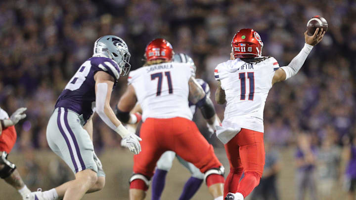 Arizona Wildcats quarterback Noah Fifita (11) throws a pass during the second quarter of the game against Kansas State at Bill Snyder Family Stadium on Friday, September 13, 2024.