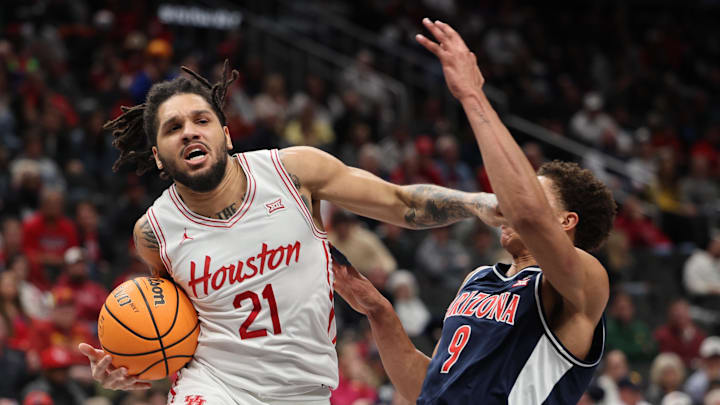 Mar 15, 2025; Kansas City, MO, USA; Houston Cougars guard Emanuel Sharp (21) goes to the basket against Arizona Wildcats forward Carter Bryant (9) during the first half for the Big 12 Conference Tournament Championship game at T-Mobile Center. Mandatory Credit: William Purnell-Imagn Images