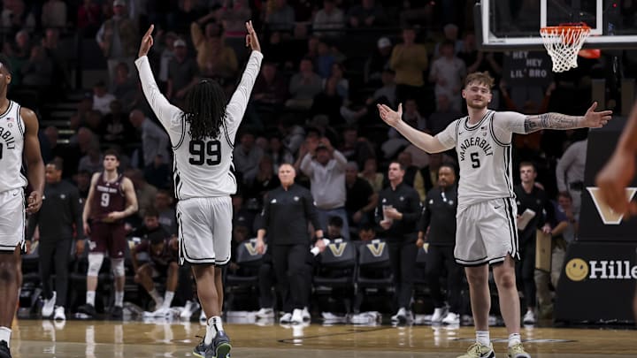 Feb 14, 2026; Nashville, Tennessee, USA;  Vanderbilt Commodores forward Devin McGlockton (99) and forward Tyler Nickel (5) reacts after a made three point basket against the Texas A&M Aggies during the second half at Memorial Gymnasium. Mandatory Credit: Steve Roberts-Imagn Images