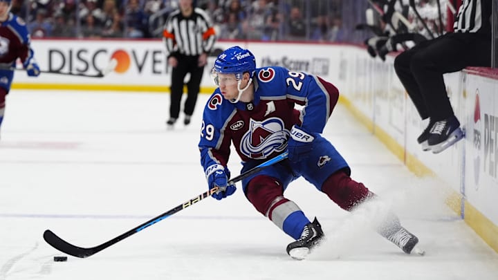 Apr 19, 2026; Denver, Colorado, USA; Colorado Avalanche center Nathan MacKinnon (29) controls the puck in the second period against the Los Angeles Kings in game one of the first round of the 2026 Stanley Cup Playoffs at Ball Arena. Mandatory Credit: Ron Chenoy-Imagn Images