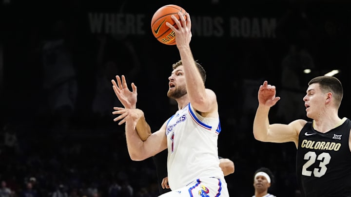 Feb 24, 2025; Boulder, Colorado, USA; Kansas Jayhawks center Hunter Dickinson (1) is fouled by Colorado Buffaloes guard Julian Hammond III (3) in the first half at the CU Events Center. Mandatory Credit: Ron Chenoy-Imagn Images