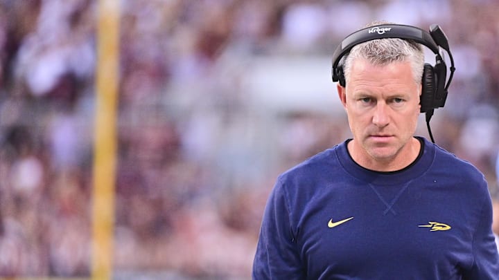 Sep 14, 2024; Starkville, Mississippi, USA; Toledo Rockets head coach Jason Candle walks down the field during the first quarter of the game against the Mississippi State Bulldogs at Davis Wade Stadium at Scott Field. Mandatory Credit: Matt Bush-Imagn Images