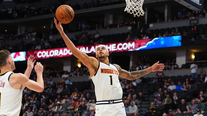 Oct 15, 2024; Denver, Colorado, USA; Denver Nuggets forward Michael Porter Jr. (1) reaches for a rebound in the second half against the Oklahoma City Thunder at Ball Arena. Mandatory Credit: Ron Chenoy-Imagn Images Oct 15, 2024; Denver, Colorado, USA; Denver Nuggets forward Michael Porter Jr. (1) reaches for a rebound in the second half against the Oklahoma City Thunder at Ball Arena. Mandatory Credit: Ron Chenoy-Imagn Images