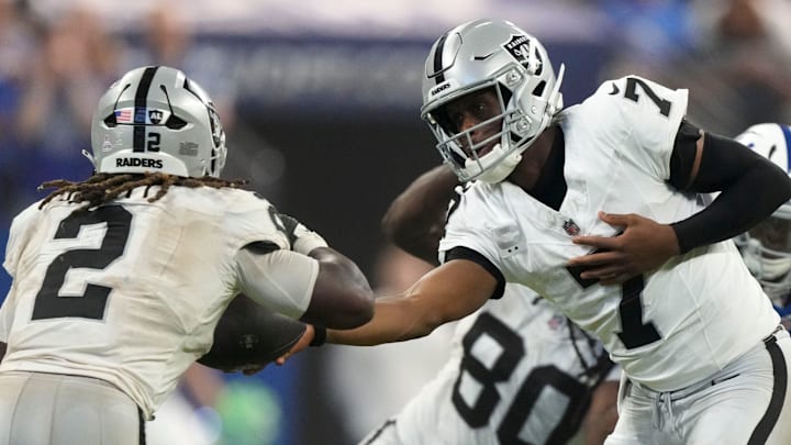 Las Vegas Raiders quarterback Geno Smith (7) hands off the ball to running back Ashton Jeanty (2) Sunday, Oct. 5, 2025, during a game against the Indianapolis Colts at Lucas Oil Stadium in Indianapolis. The Colts defeated the Raiders 40-6. Las Vegas Raiders quarterback Geno Smith (7) hands off the ball to running back Ashton Jeanty (2) Sunday, Oct. 5, 2025, during a game against the Indianapolis Colts at Lucas Oil Stadium in Indianapolis. The Colts defeated the Raiders 40-6.