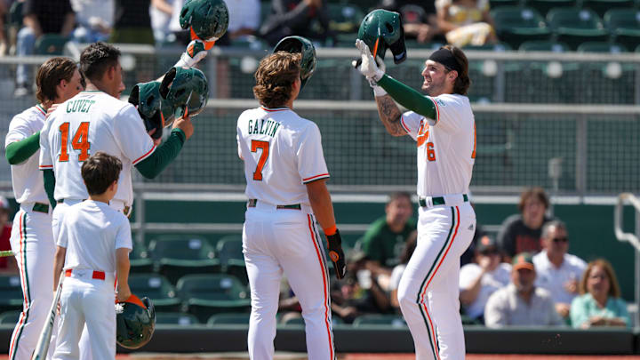 The Miami Hurricanes after a home run celebrating.