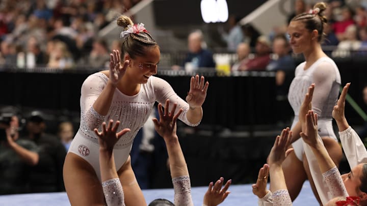 Gabby Ladanyi high fives her Alabama gymnastics teammates after a beam routine at Elevate the Stage in Huntsville- March 9, 2025 Gabby Ladanyi high fives her Alabama gymnastics teammates after a beam routine at Elevate the Stage in Huntsville- March 9, 2025