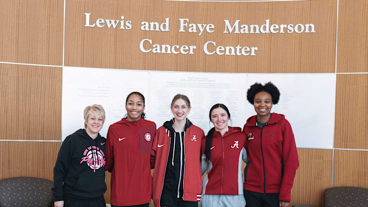 Alabama women's basketball coach Kristy Curry along with players at the Manderson Cancer Center in Tuscaloosa