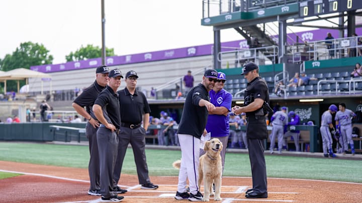 TCU head coach Kirk Saarloos with his dog Bud ahead of Tuesday night's game. 