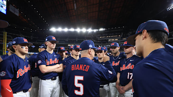 Ole Miss baseball coach Mike Bianco talks to players before the game against the Texas Longhorns at the Shriners Children's College Showdown in Arlington, Texas.