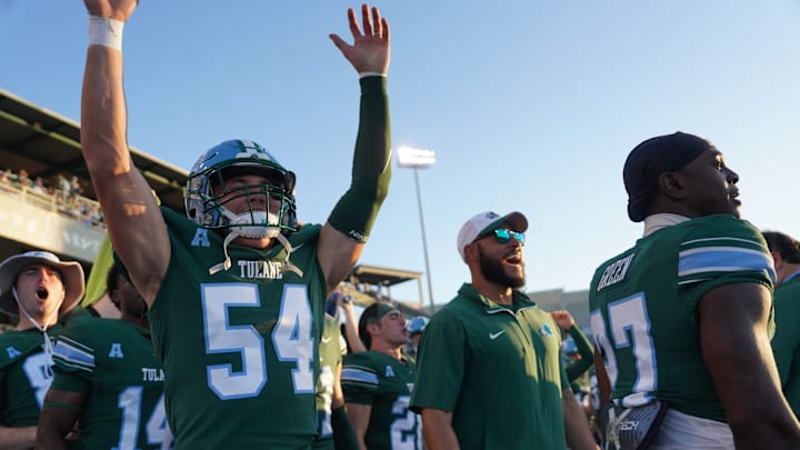 Tulane Green Wave players and coaches