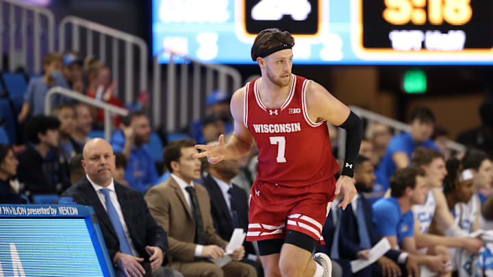 Jan 21, 2025; Los Angeles, California, USA;  Wisconsin Badgers forward Carter Gilmore (7) reacts after making a three-point basket during the first half against the UCLA Bruins at Pauley Pavilion presented by Wescom. Mandatory Credit: Kiyoshi Mio-Imagn Images