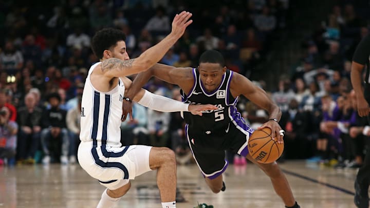 Dec 5, 2024; Memphis, Tennessee, USA; Sacramento Kings guard De'Aaron Fox (5) drives to the basket against Memphis Grizzlies guard Scotty Pippen Jr. (1) during the fourth quarter at FedExForum. Mandatory Credit: Petre Thomas-Imagn Images