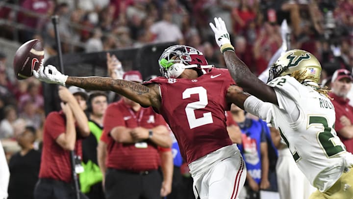 Sep 7, 2024; Tuscaloosa, Alabama, USA; A pass from Alabama Crimson Tide quarterback Jalen Milroe (4) is just off the fingertips of Alabama Crimson Tide wide receiver Ryan Williams (2) as he is closely defended by South Florida Bulls cornerback De'Shawn Rucker (22) at Bryant-Denny Stadium. Alabama defeated South Florida 42-16. Mandatory Credit: Gary Cosby Jr.-USA TODAY Network via Imagn Images Sep 7, 2024; Tuscaloosa, Alabama, USA; A pass from Alabama Crimson Tide quarterback Jalen Milroe (4) is just off the fingertips of Alabama Crimson Tide wide receiver Ryan Williams (2) as he is closely defended by South Florida Bulls cornerback De'Shawn Rucker (22) at Bryant-Denny Stadium. Alabama defeated South Florida 42-16. Mandatory Credit: Gary Cosby Jr.-USA TODAY Network via Imagn Images
