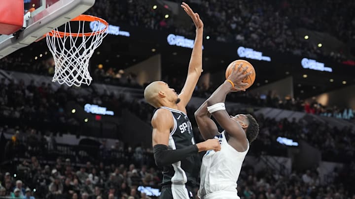 Jan 17, 2026; San Antonio, Texas, USA; Minnesota Timberwolves guard Anthony Edwards (5) shoots against San Antonio Spurs forward Victor Wembanyama (1) in the first half at Frost Bank Center.
