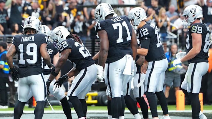 Oct 13, 2024; Paradise, Nevada, USA; Las Vegas Raiders running back Alexander Mattison (22) celebrates after scoring a touchdown against the Pittsburgh Steelers during the first quarter at Allegiant Stadium. Mandatory Credit: Stephen R. Sylvanie-Imagn Images