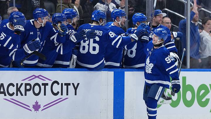 Oct 6, 2026; Toronto, Ontario, CAN;  Toronto Maple Leafs left wing Gavin McKenna (92) celebrates at the bench after scoring his first NHL career goal against the Nashville Predators during the second period at Scotiabank Arena.  Mandatory Credit: Nick Turchiaro-Imagn Images
