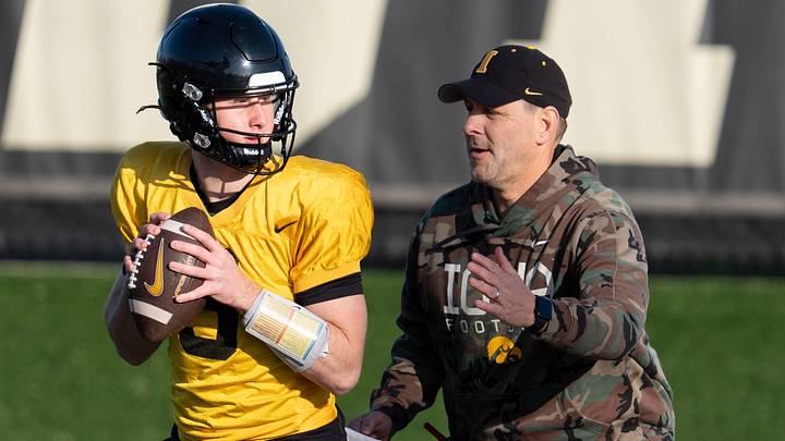 Iowa offensive coordinator Tim Lester pressures quarterback Jimmy Sullivan (3) during a drill at practice April 9, 2026 in Iowa City, Iowa. Iowa offensive coordinator Tim Lester pressures quarterback Jimmy Sullivan (3) during a drill at practice April 9, 2026 in Iowa City, Iowa.