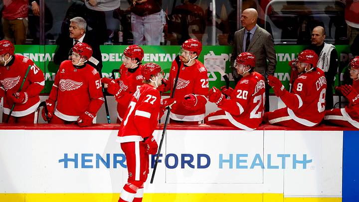 Mar 4, 2026; Detroit, Michigan, USA;  Detroit Red Wings defenseman Simon Edvinsson (77) receives congratulations from teammates after scoring in the first period against the Vegas Golden Knights at Little Caesars Arena. Mandatory Credit: Rick Osentoski-Imagn Images