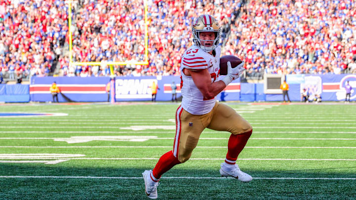 Nov 2, 2025; East Rutherford, New Jersey, USA; San Francisco 49ers running back Christian McCaffrey (23) runs after the catch for a touchdown against the New York Giants during the first half at MetLife Stadium. Mandatory Credit: Ed Mulholland-Imagn Images