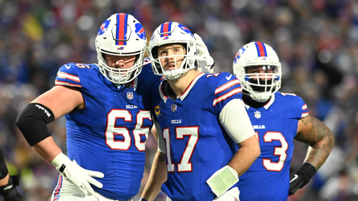 Dec 17, 2023; Orchard Park, New York, USA; Buffalo Bills guard Connor McGovern (66) talks with quarterback Josh Allen (17) in the first half against the Dallas Cowboys at Highmark Stadium. 