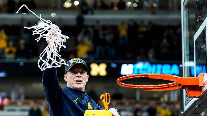 Michigan coach Dusty May celebrates after winning the NCAA Tournament Midwest Regional final by defeating Tennessee 95-62 at United Center in Chicago on Sunday, March 29, 2026.