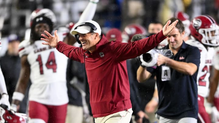Nov 9, 2024; Nashville, Tennessee, USA;  South Carolina Gamecocks head coach Shane Beamer celebrates the win with defensive back Vicari Swain (4) against the Vanderbilt Commodores during the second half at FirstBank Stadium. Mandatory Credit: Steve Roberts-Imagn Images