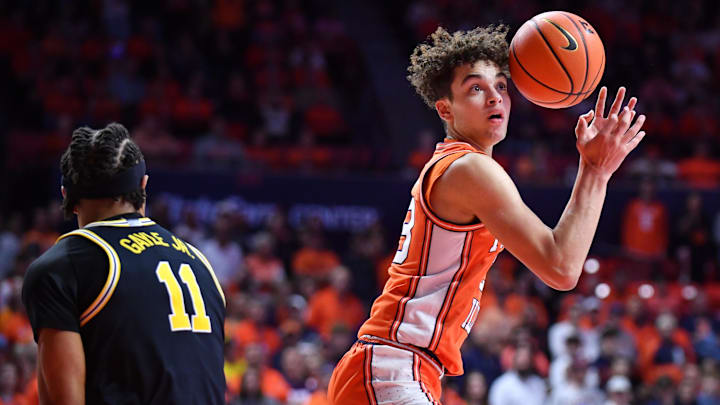 Feb 27, 2026; Champaign, Illinois, USA;  Illinois Fighting Illini guard Keaton Wagler (23) loses his handle on the ball as Michigan Wolverines guard Roddy Gayle Jr. (11) defends during the first half at State Farm Center. Mandatory Credit: Ron Johnson-Imagn Images