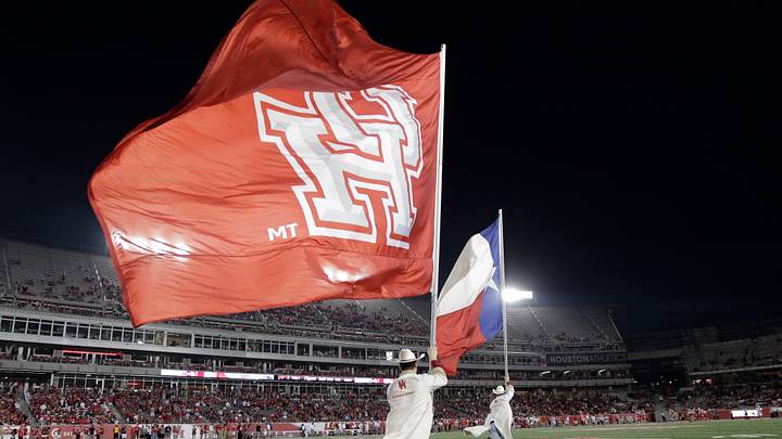 Houston Frontiersmen run with the Texas state flag and the U of H flag after a Cougar touchdown in 2025 against SMU. Mandatory Credit: Erich Schlegel-USA TODAY Sports Houston Frontiersmen run with the Texas state flag and the U of H flag after a Cougar touchdown in 2025 against SMU. Mandatory Credit: Erich Schlegel-USA TODAY Sports