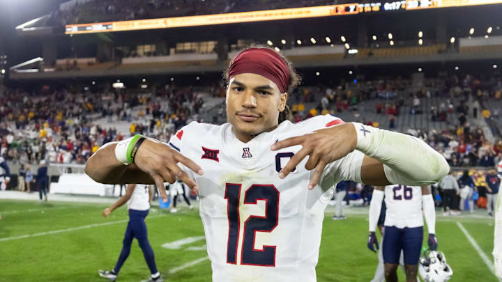 Nov 28, 2025; Tempe, Arizona, USA; Arizona Wildcats defensive back Genesis Smith (12) celebrates after defeating the Arizona State Sun Devils in the 99th Territorial Cup at Mountain America Stadium. Mandatory Credit: Mark J. Rebilas-Imagn Images
