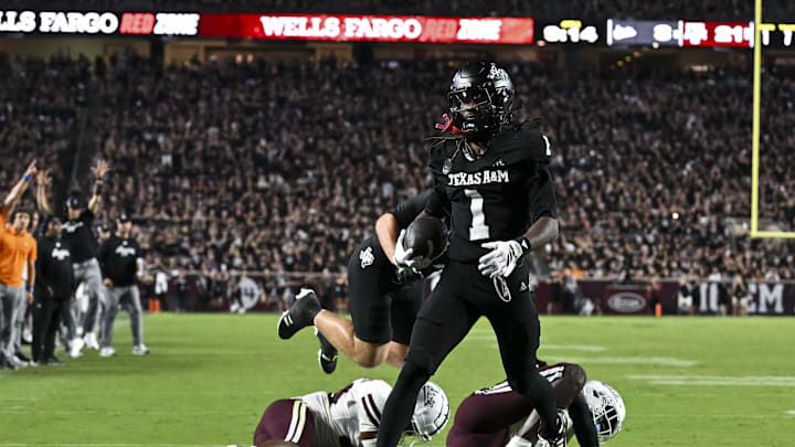 Oct 4, 2025; College Station, Texas, USA; Texas A&M Aggies wide receiver Mario Craver (1) runs the ball in for a touchdown during the fourth quarter against the Mississippi State Bulldogs at Kyle Field. Mandatory Credit: Maria Lysaker-Imagn Images 
