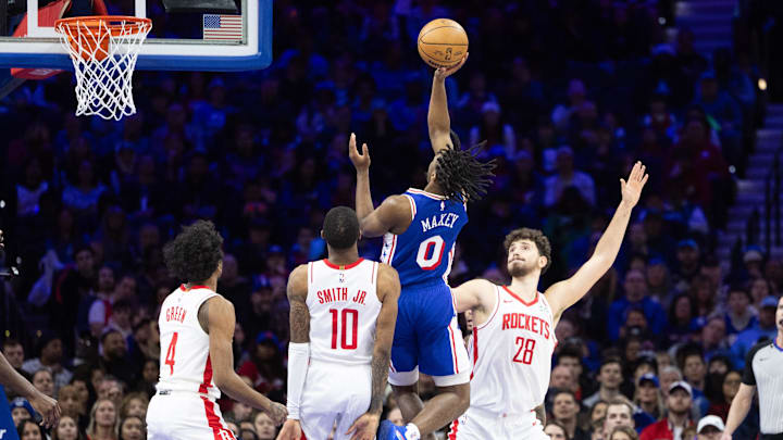 Jan 15, 2024; Philadelphia, Pennsylvania, USA; Philadelphia 76ers guard Tyrese Maxey (0) drives for a shot against Houston Rockets center Alperen Sengun (28) and forward Jabari Smith Jr. (10) during the third quarter at Wells Fargo Center. Mandatory Credit: Bill Streicher-Imagn Images Jan 15, 2024; Philadelphia, Pennsylvania, USA; Philadelphia 76ers guard Tyrese Maxey (0) drives for a shot against Houston Rockets center Alperen Sengun (28) and forward Jabari Smith Jr. (10) during the third quarter at Wells Fargo Center. Mandatory Credit: Bill Streicher-Imagn Images