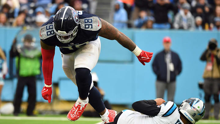 Nov 26, 2023; Nashville, Tennessee, USA; Carolina Panthers quarterback Bryce Young (9) is sacked by Tennessee Titans defensive tackle Jeffery Simmons (98) during the second half at Nissan Stadium. Mandatory Credit: Christopher Hanewinckel-USA TODAY Sports Nov 26, 2023; Nashville, Tennessee, USA; Carolina Panthers quarterback Bryce Young (9) is sacked by Tennessee Titans defensive tackle Jeffery Simmons (98) during the second half at Nissan Stadium. Mandatory Credit: Christopher Hanewinckel-USA TODAY Sports
