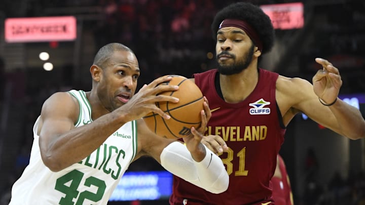 Dec 1, 2024; Cleveland, Ohio, USA; Boston Celtics center Al Horford (42) controls the ball as Cleveland Cavaliers center Jarrett Allen (31) defends in the second quarter at Rocket Mortgage FieldHouse. Mandatory Credit: David Richard-Imagn Images