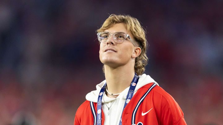 Jan 8, 2026; Glendale, AZ, USA; Mississippi Rebels former quarterback Jaxson Dart in attendance against the Miami Hurricanes during the 2026 Fiesta Bowl and semifinal game of the College Football Playoff at State Farm Stadium.  