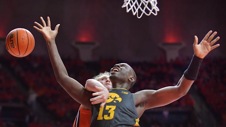 Illinois Fighting Illini forward Jake Davis (15) fouls Iowa Hawkeyes forward Ladji Dembele (13) during the second half at State Farm Center. Illinois Fighting Illini forward Jake Davis (15) fouls Iowa Hawkeyes forward Ladji Dembele (13) during the second half at State Farm Center.