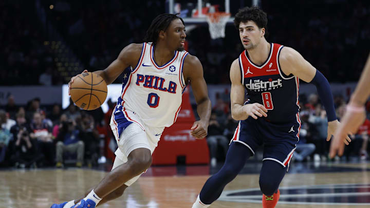 Feb 10, 2024; Washington, District of Columbia, USA; Philadelphia 76ers guard Tyrese Maxey (0) drives to the basket as Washington Wizards forward Deni Avdija (8) defends in the first half at Capital One Arena. Mandatory Credit: Geoff Burke-Imagn Images