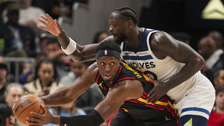 Dec 31, 2025; Atlanta, Georgia, USA; Atlanta Hawks forward Onyeka Okongwu (17) protects the ball from Minnesota Timberwolves forward Julius Randle (30) during the second half at State Farm Arena. Mandatory Credit: Dale Zanine-Imagn Images